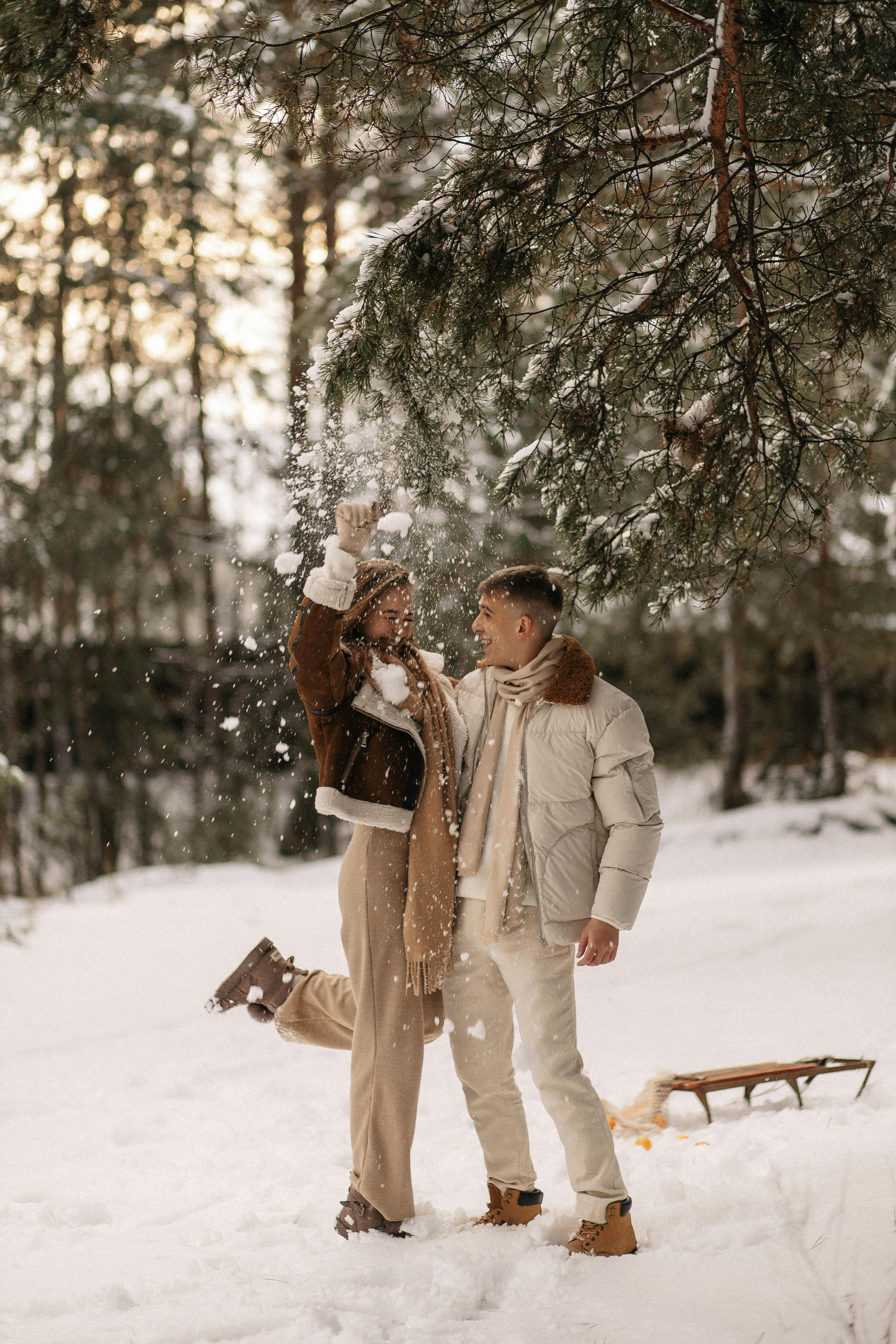 romantic winter portrait of couple embracing in snowy forest - a Royalty  Free Stock Photo from Photocase