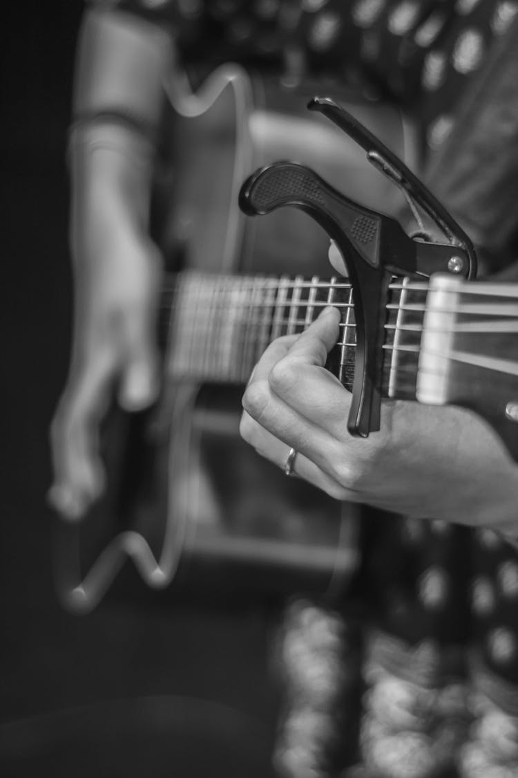 Hand Of A Man Playing The Guitar