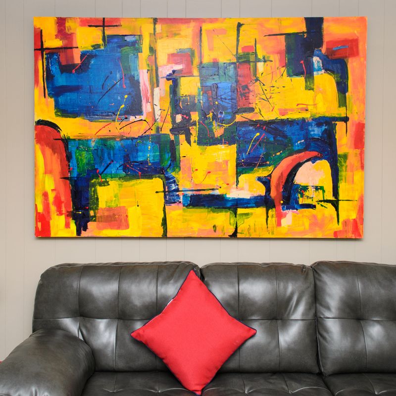 Geometric painting in primary colors on a gallery wall
