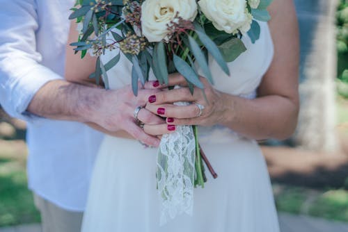 Free Woman Holding White Bouquet Stock Photo