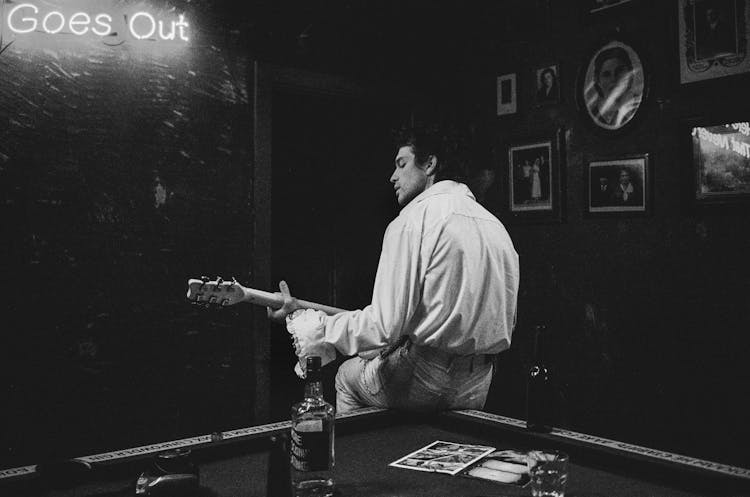 Man Playing Guitar In Bar