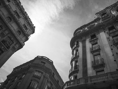 Grayscale Photo of Buildings under the Sky