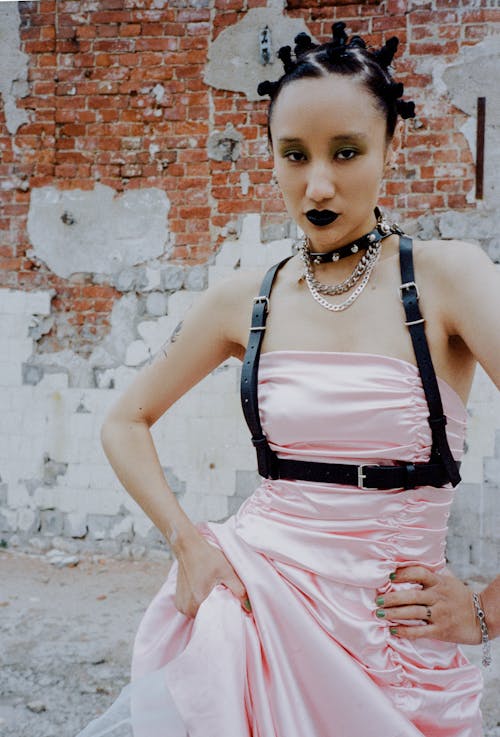 Woman in Pink Dress and Spiked Collar