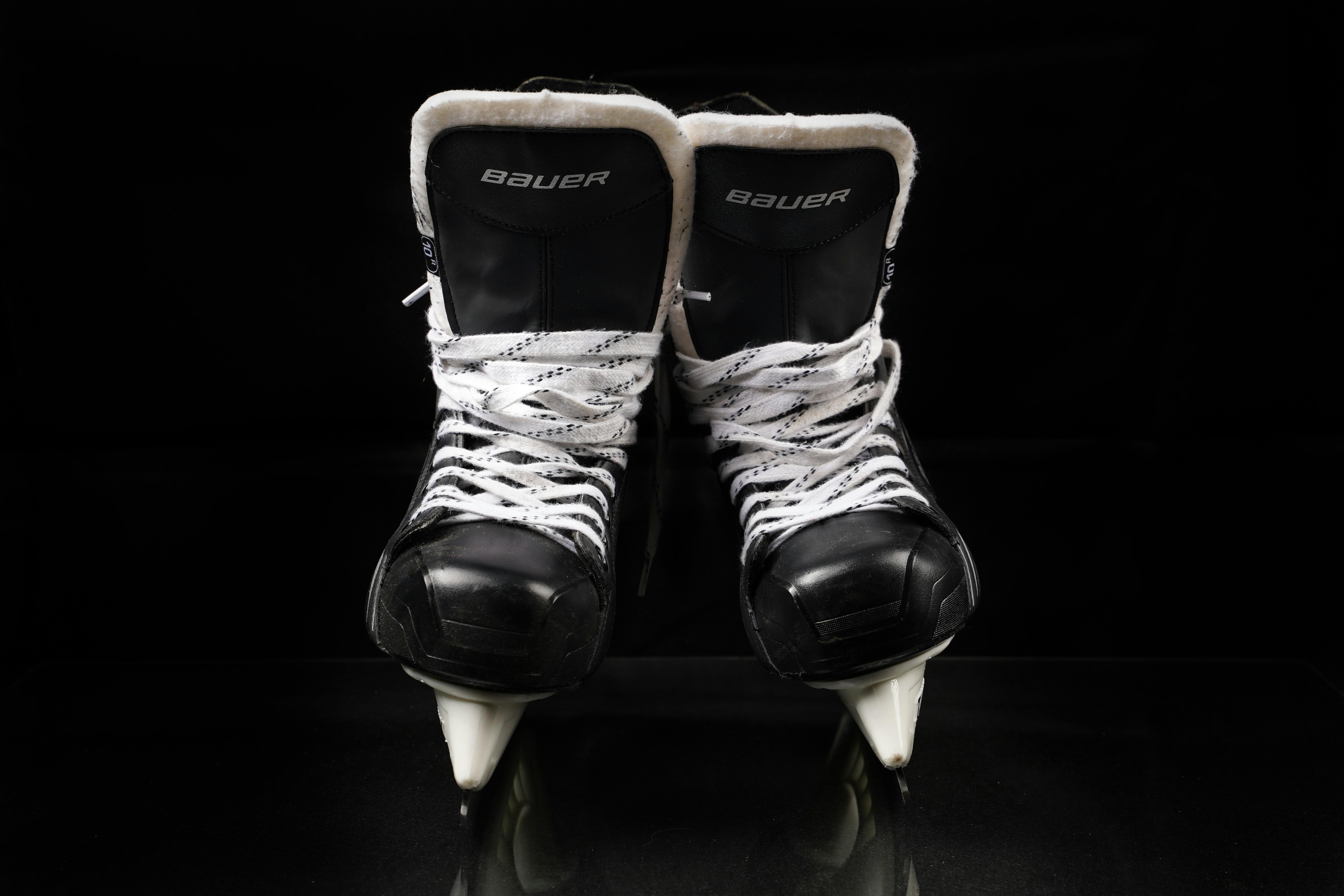 Hanged Pair of White Leather Figure Skates · Free Stock Photo