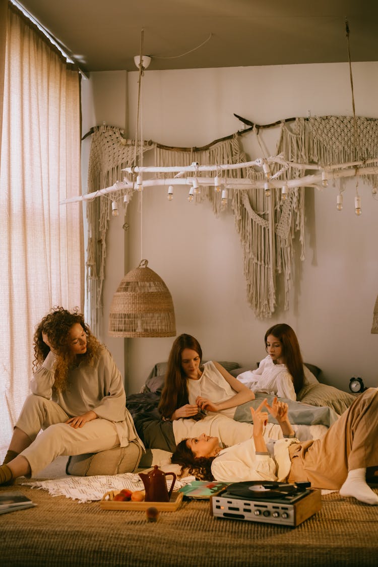 Women Listening To Vinyl Record In A Room 