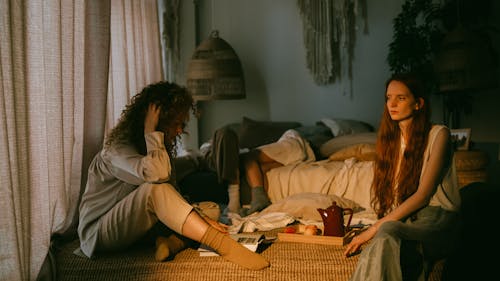 Women Relaxing in a Bedroom 