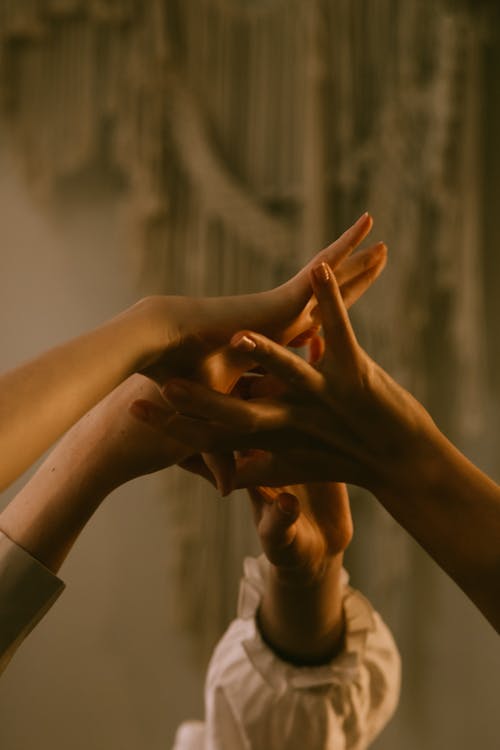 Close-up of Girls Holding Outstretched Hands