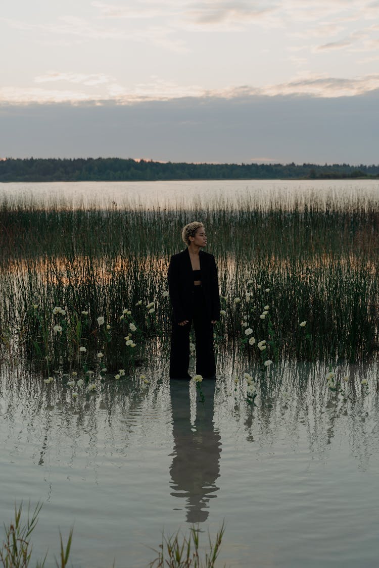 Woman Standing On Shallow Water