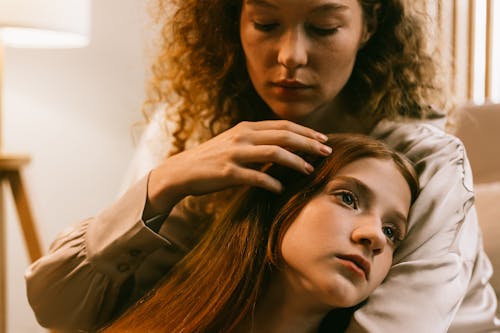 Woman Embracing Her Female Friend