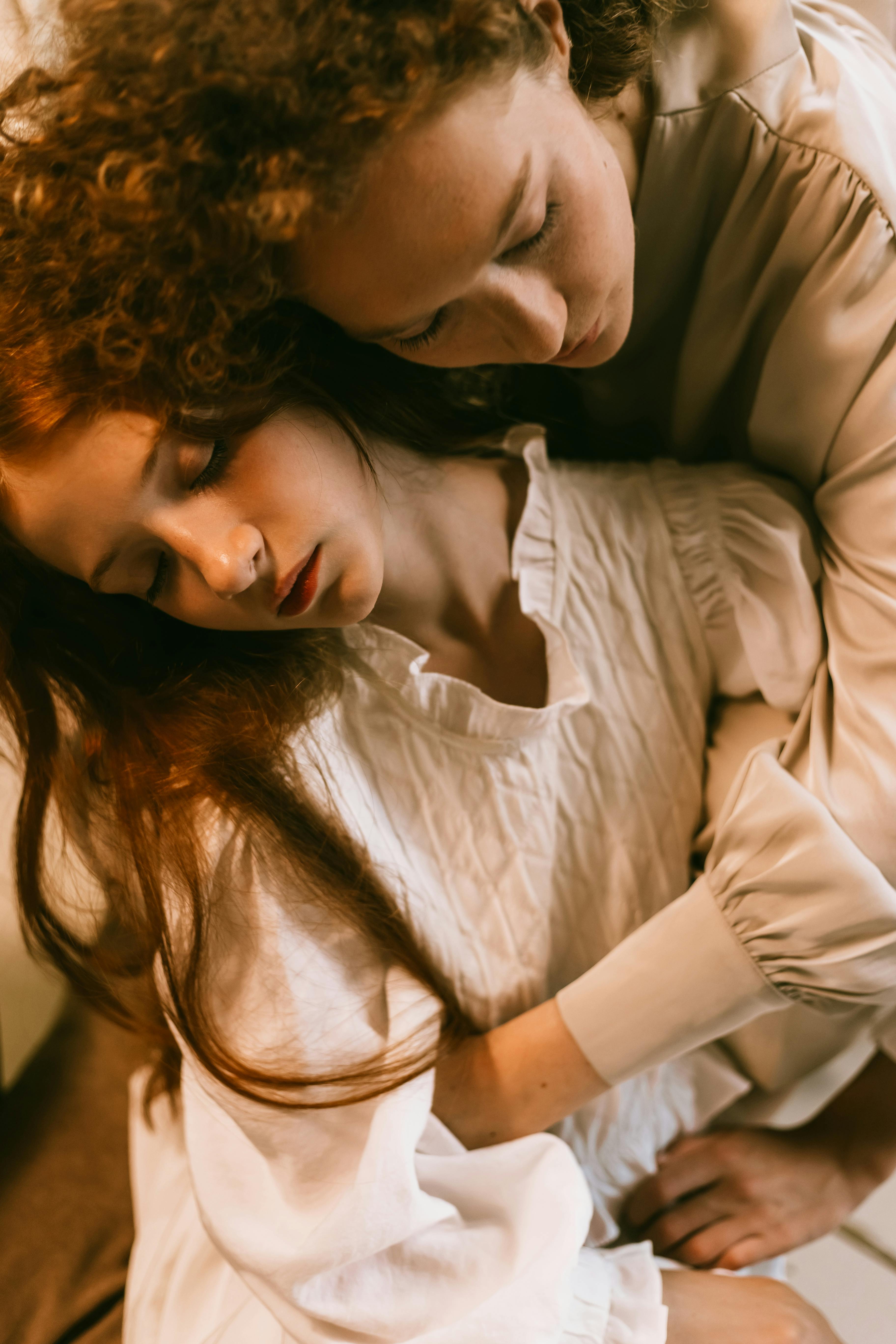 redhead woman hugging female friend