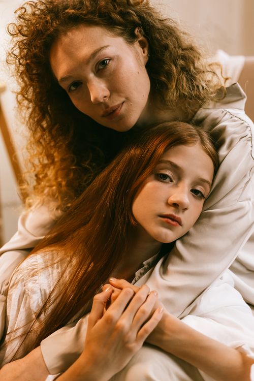 Free Tender portrait of a mother and daughter embracing with love and warmth. Stock Photo