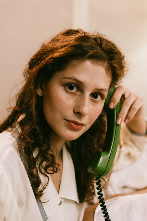 Portrait of Redheaded Woman Talking on the Phone