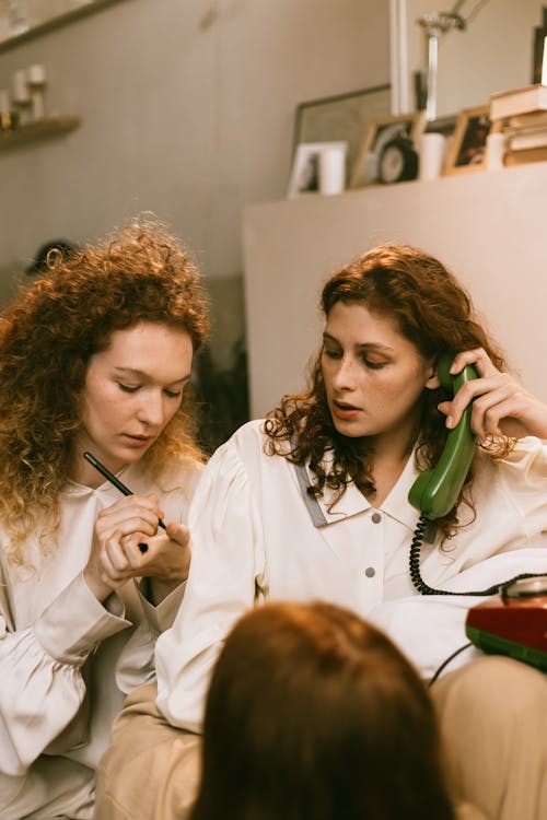 Female Friends Talking on the Phone