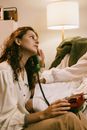 Redhead Woman Talking on the Phone at Home