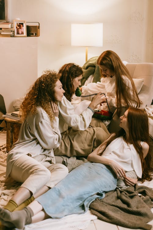 Redhead Women Talking on the Phone during Sleepover