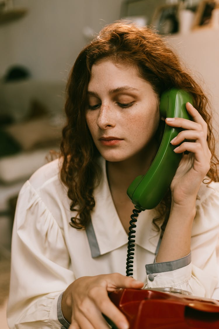 Redheaded Woman Talking On The Phone