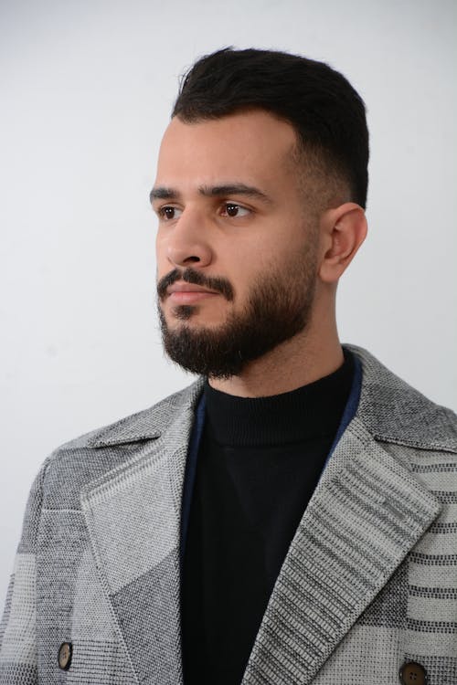 Free Bearded Man in Gray Coat Looking Afar Stock Photo