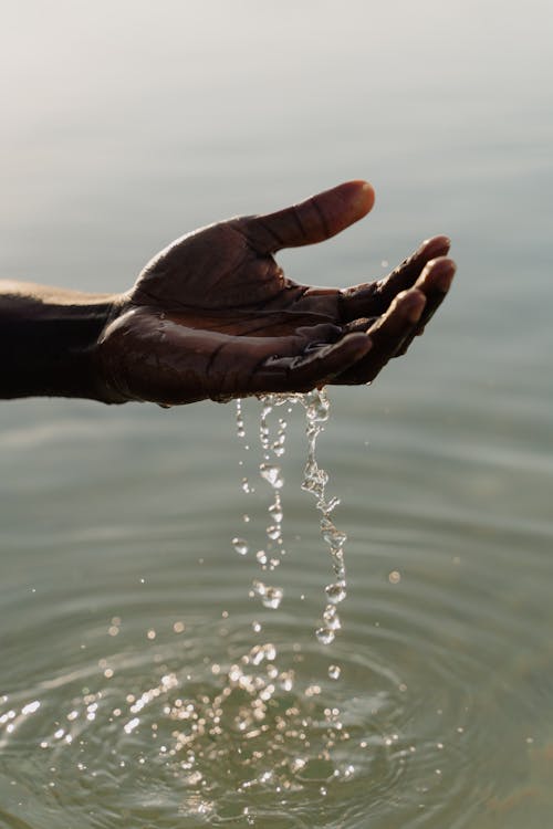 Man Hand and Water Surface