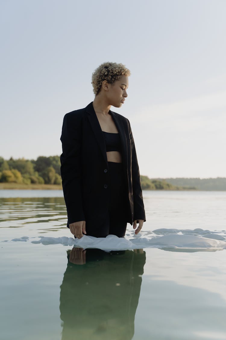 Woman In Black Blazer Standing In The Water