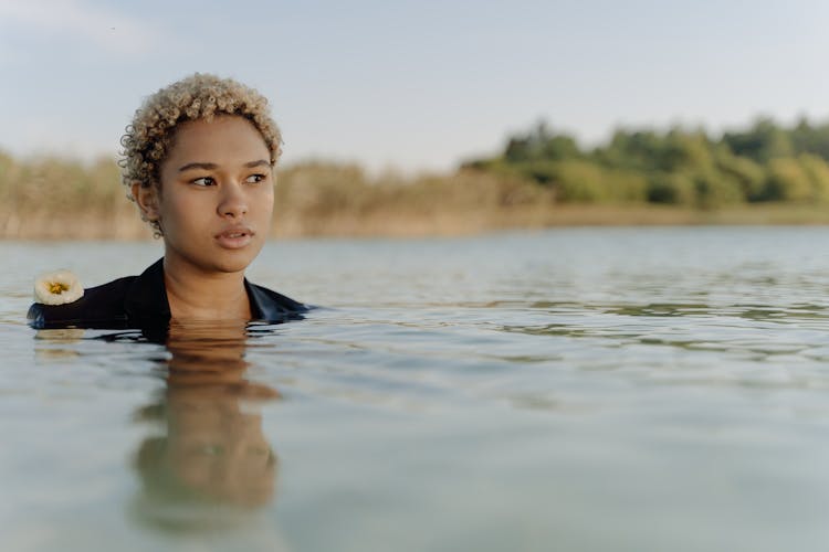 Woman Swimming On A Lake