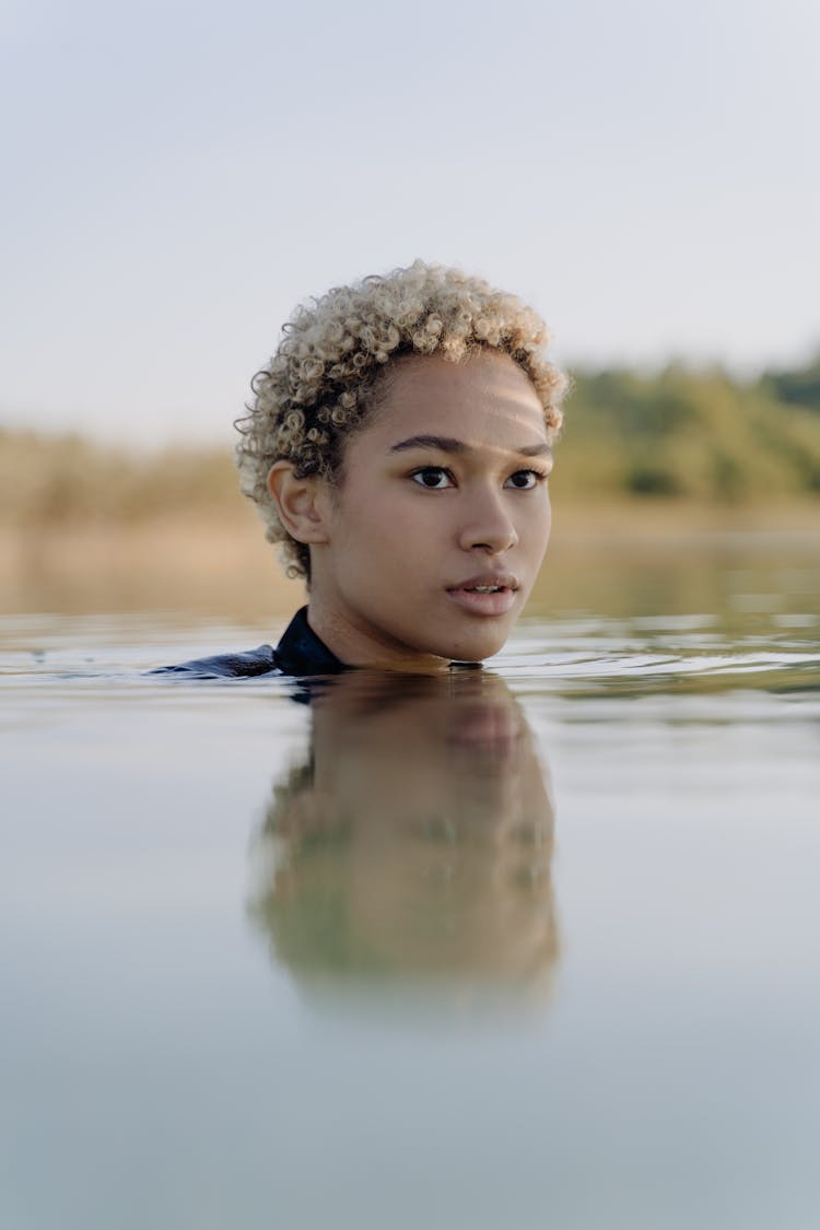 Pretty Woman Swimming On A Lake