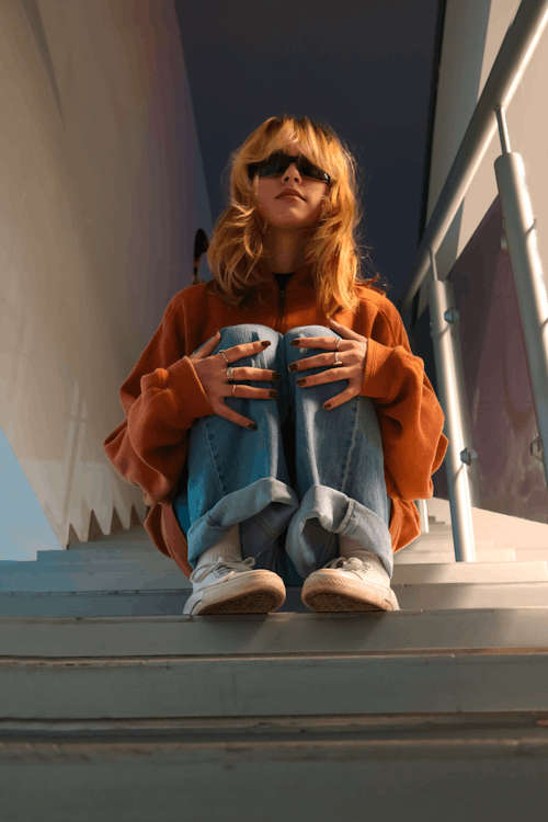 Woman Sitting on Stairs