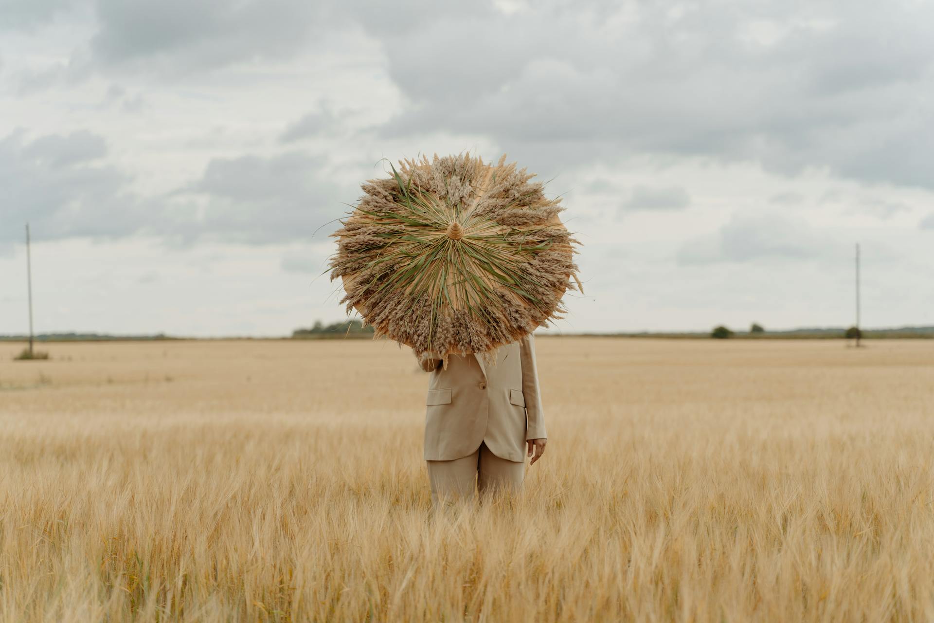 Woman With Wheat Umbrella on Field