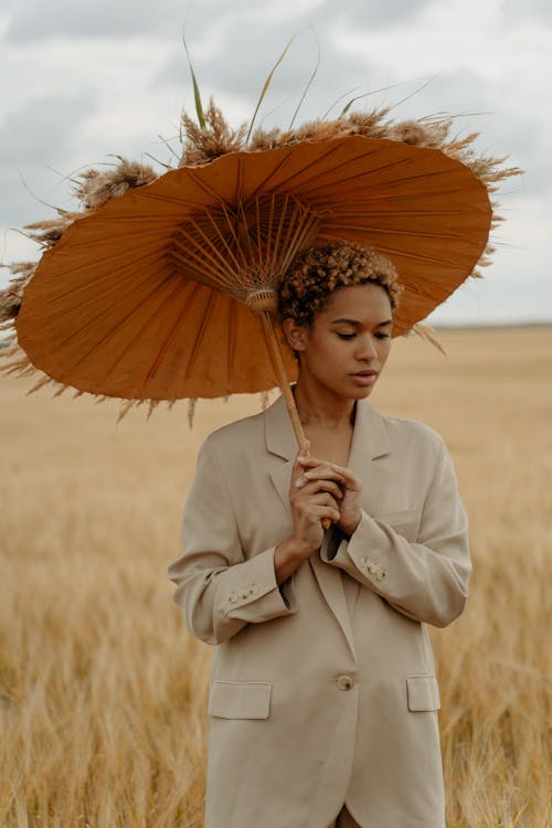 Woman With Wheat Umbrella on Field