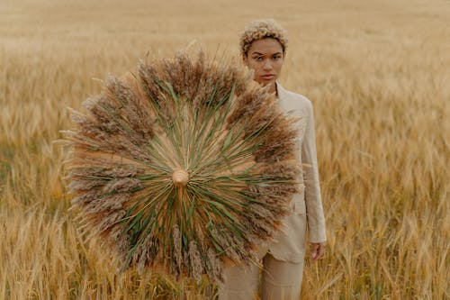 Woman on Meadow Holding Wheat Umbrella