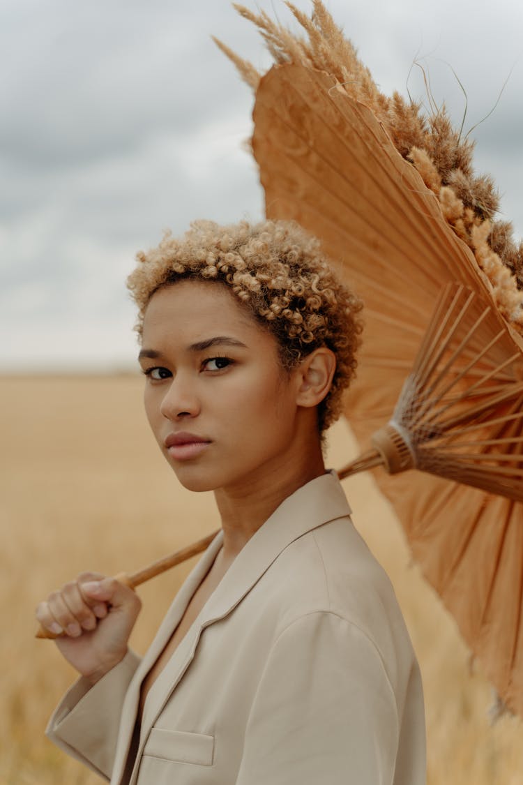 Curly Hair Woman Holding An Umbrella 