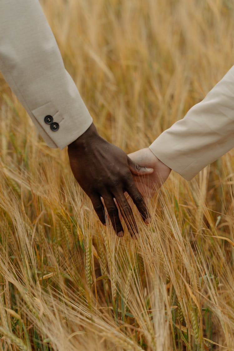 A Couple Holding Each Others Hand