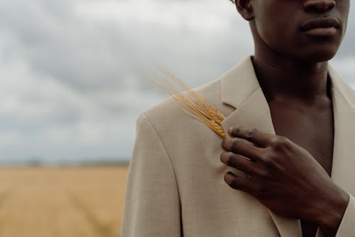 Man with Wheat on Field