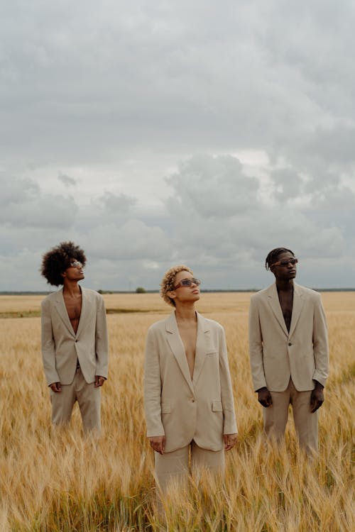 Models Standing on the Wheat Field