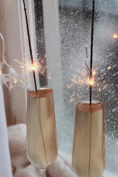 Three Brown Wooden Sticks With White String Lights