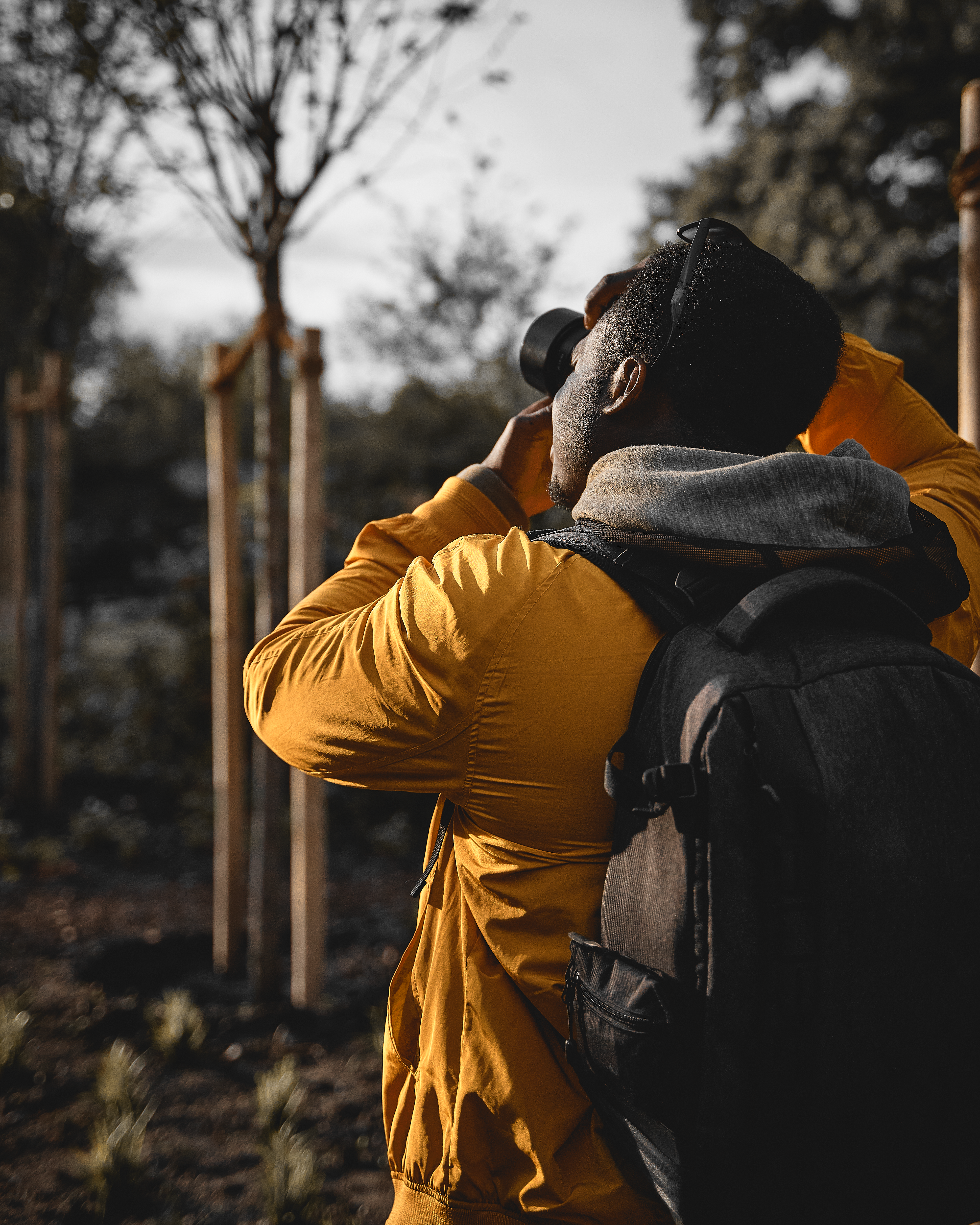 A Person in Yellow Jacket with a Backpack · Free Stock Photo