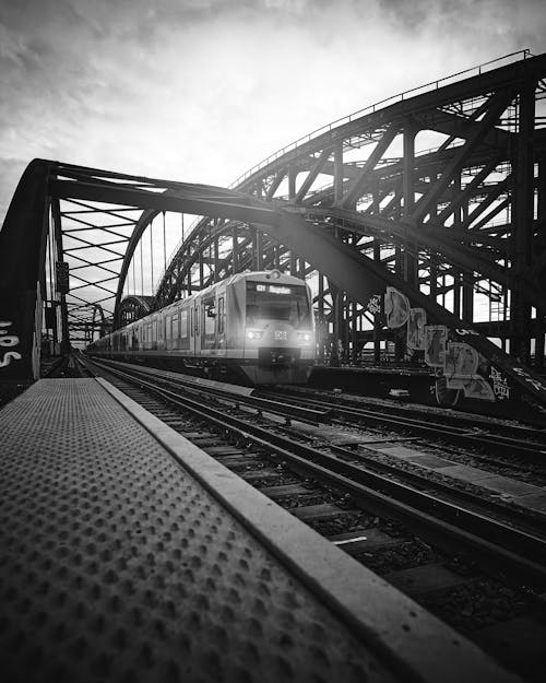 Grayscale Photo of a Train on Railway