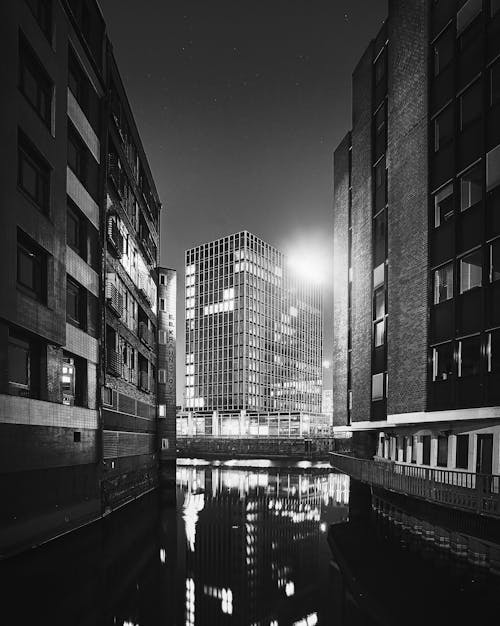 Grayscale Photo of City Buildings