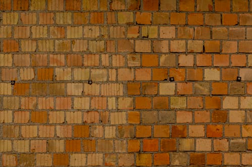 A Brown Brick Wall with Rough Surface