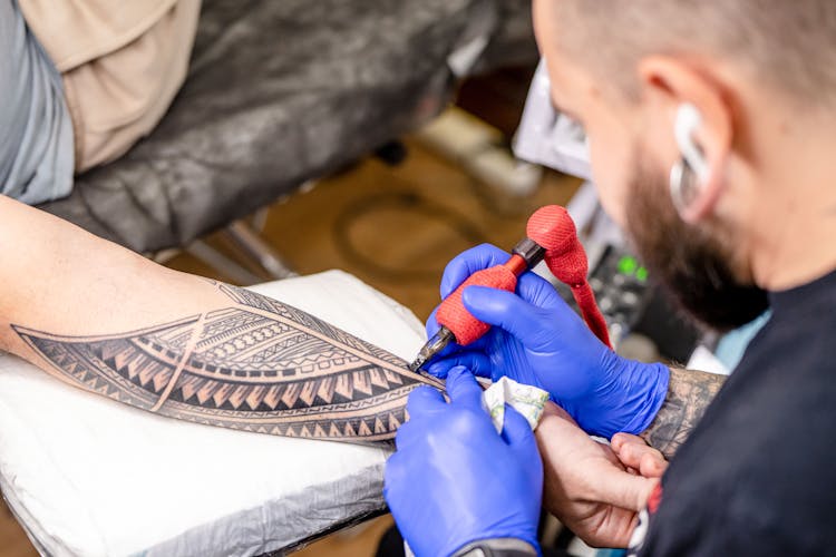 Man Tattooing Arm