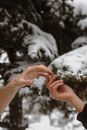 Hands Touching in the Natural Winter Background