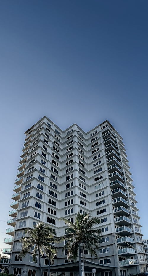 Free Low-Angle Shot of a High Rise Building under the Blue Sky Stock Photo