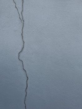 A damaged home foundation illustrating the importance of understanding earthquake insurance coverage limits.
