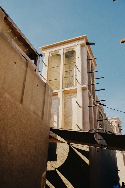 Free Low angle shot of historical wind tower architecture in Dubai, showcasing traditional construction techniques. Stock Photo