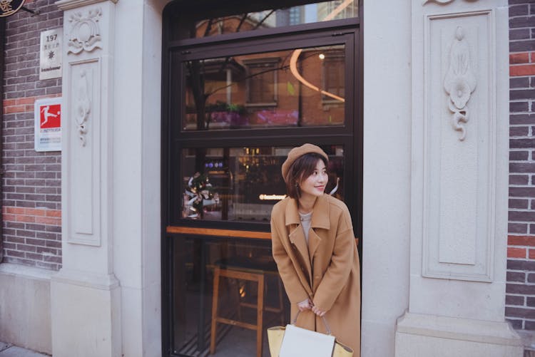 Woman Standing In Front Of Door