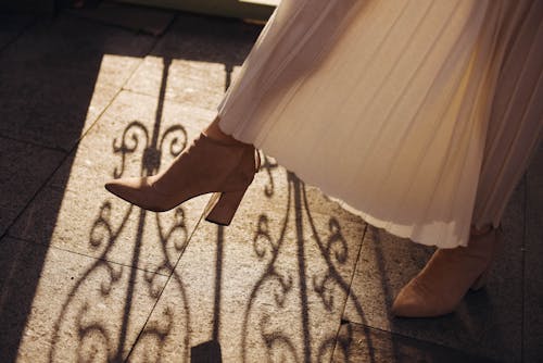 Woman Wearing High Heels and Dress