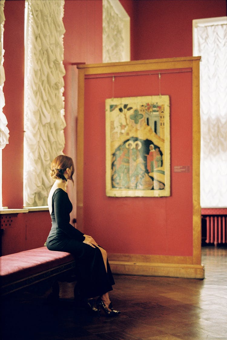 Woman In Black Dress In Museum