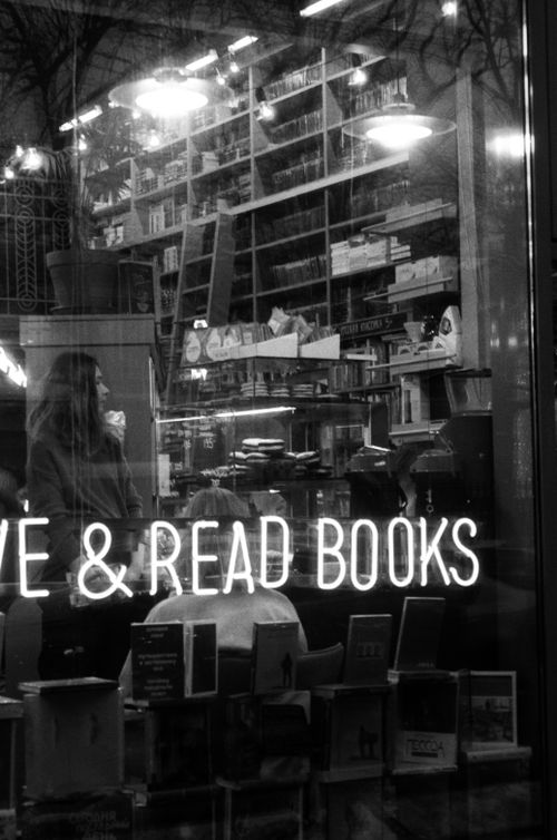 Free Black and white photo of people in a Saint Petersburg bookstore through a glass window. Stock Photo