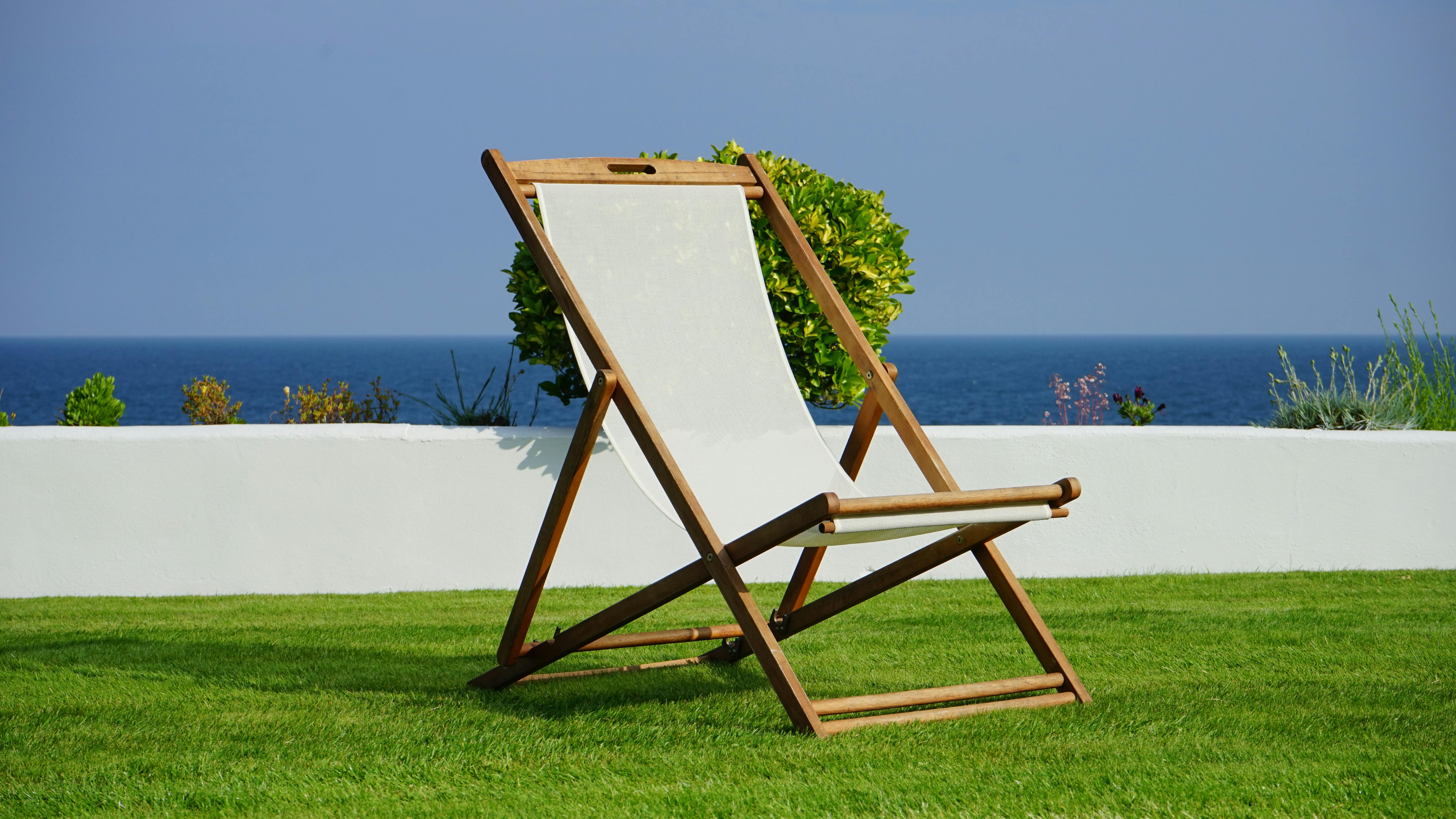 brown and white wooden lounger