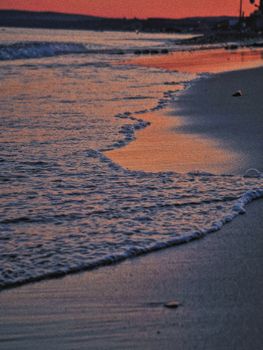 Enjoy a breathtaking sunset over the wave-kissed shores of Veselovka beach, Russia.
