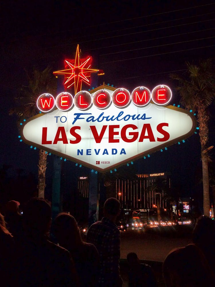 Illuminated City Sign At Night